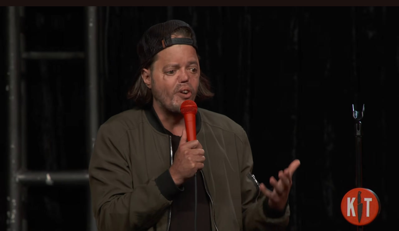Shay Freeman, first bucket pull of Kill Tony #780, onstage at the Intuit Dome with a red microphone.